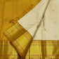 Warm Ivory Handwoven Pure Silk Kanchipuram Saree with Bavanji Border and Mayil Chakram, contrasting border detail