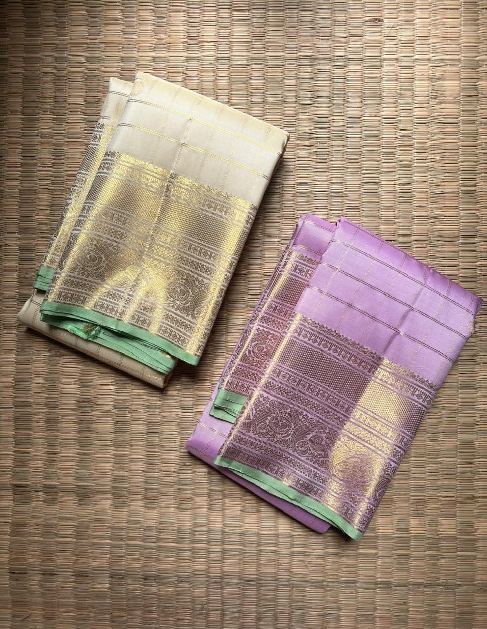 Warm Ivory Pure Silk Kanchipuram Zari Kattam saree with Kamalam buttas and Mint Green ornate zari border.