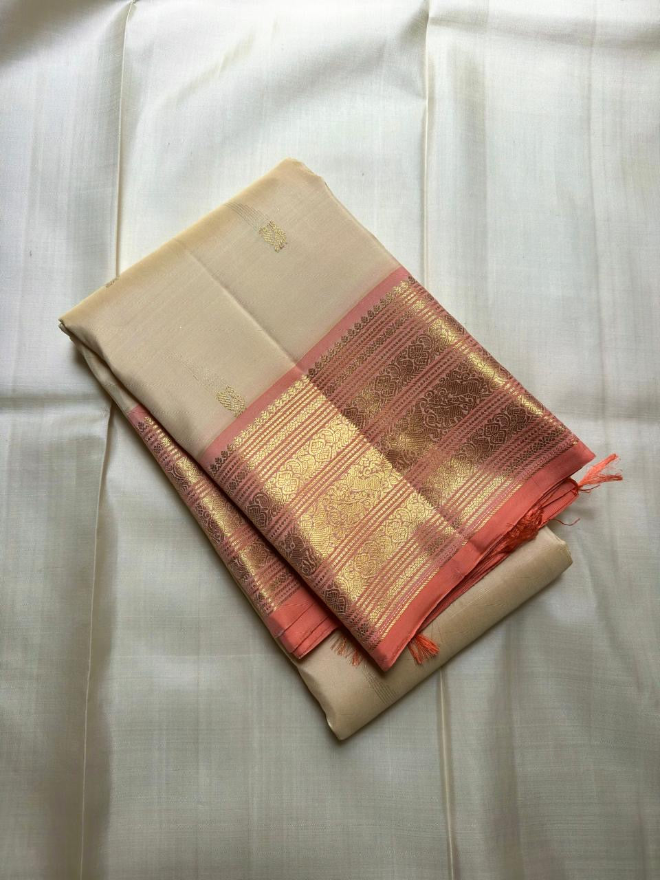 Handwoven Pearl Ivory Pure Silk Kanchipuram showing a soft jasmine-petal ivory body colour.