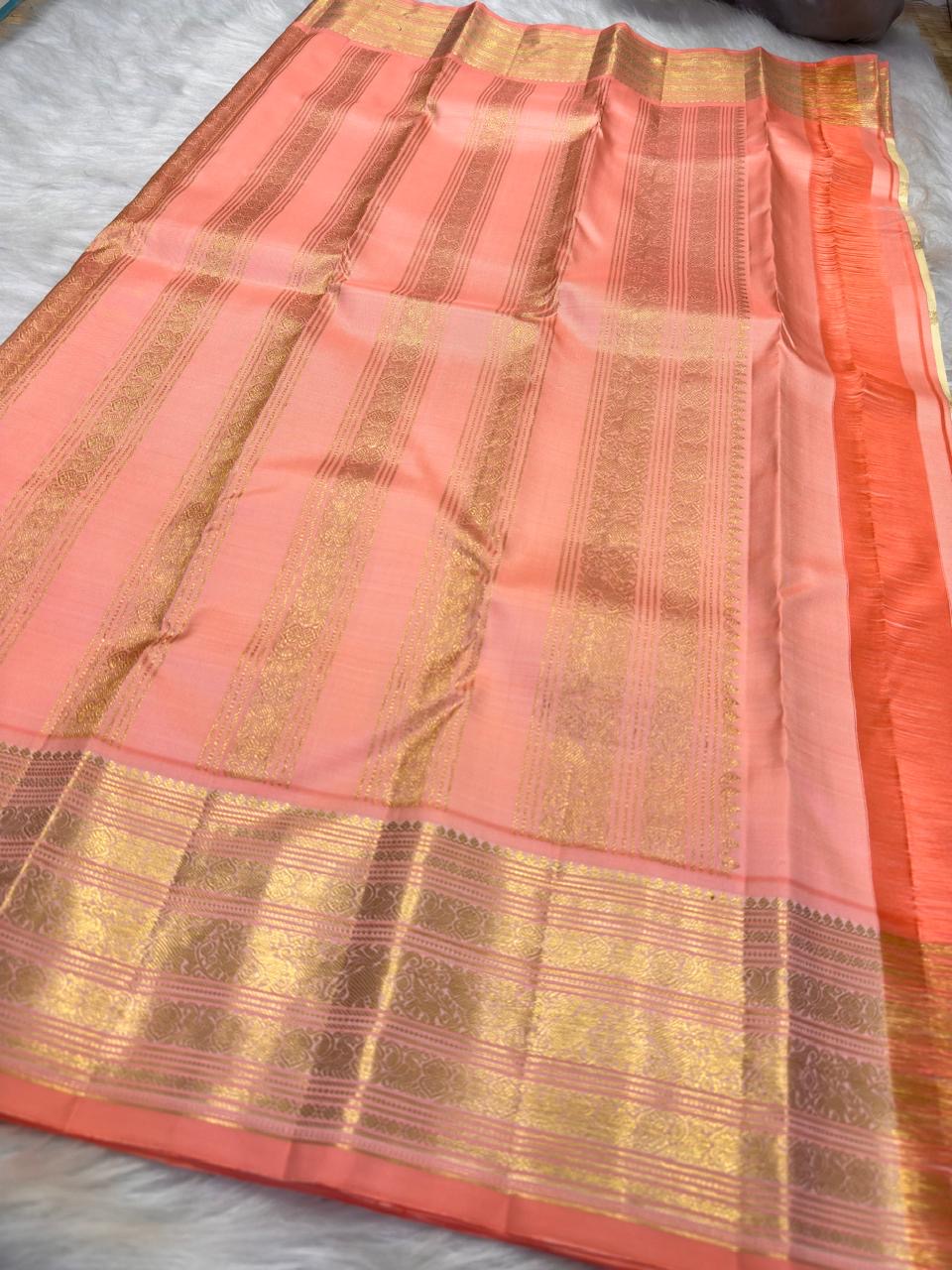 Luminous Pearl Ivory Kanchipuram body scattered with delicate traditional classic-gold zari buttas.