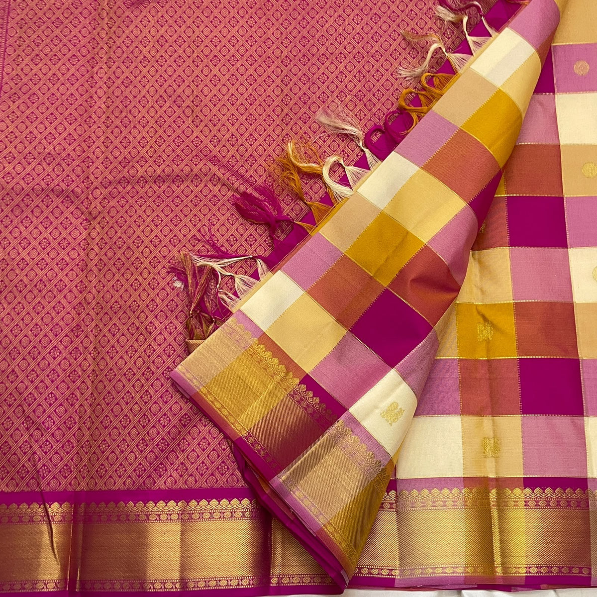 Multicolour Kanchipuram silk saree with large ivory pink lavender rust and gold woven squares.