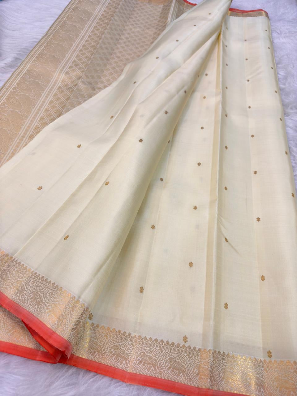 Ivory Handwoven Pure Silk Kanjivaram Saree with Small Gold Buttas & Petite Zari Elephant Border