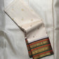 Ivory handwoven pure silk Kanchipuram varisaipet saree with zari and silk thread bands