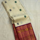 Ivory pure silk Kanjivaram body with Mayil Chakram buttas, close view