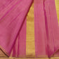 Close view of Rani Pink triangular temple edge against Warm Ivory Kanjivaram silk.