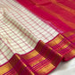 Ivory raspberry pink handwoven pure silk Kanchipuram saree with gold zari border, folded view