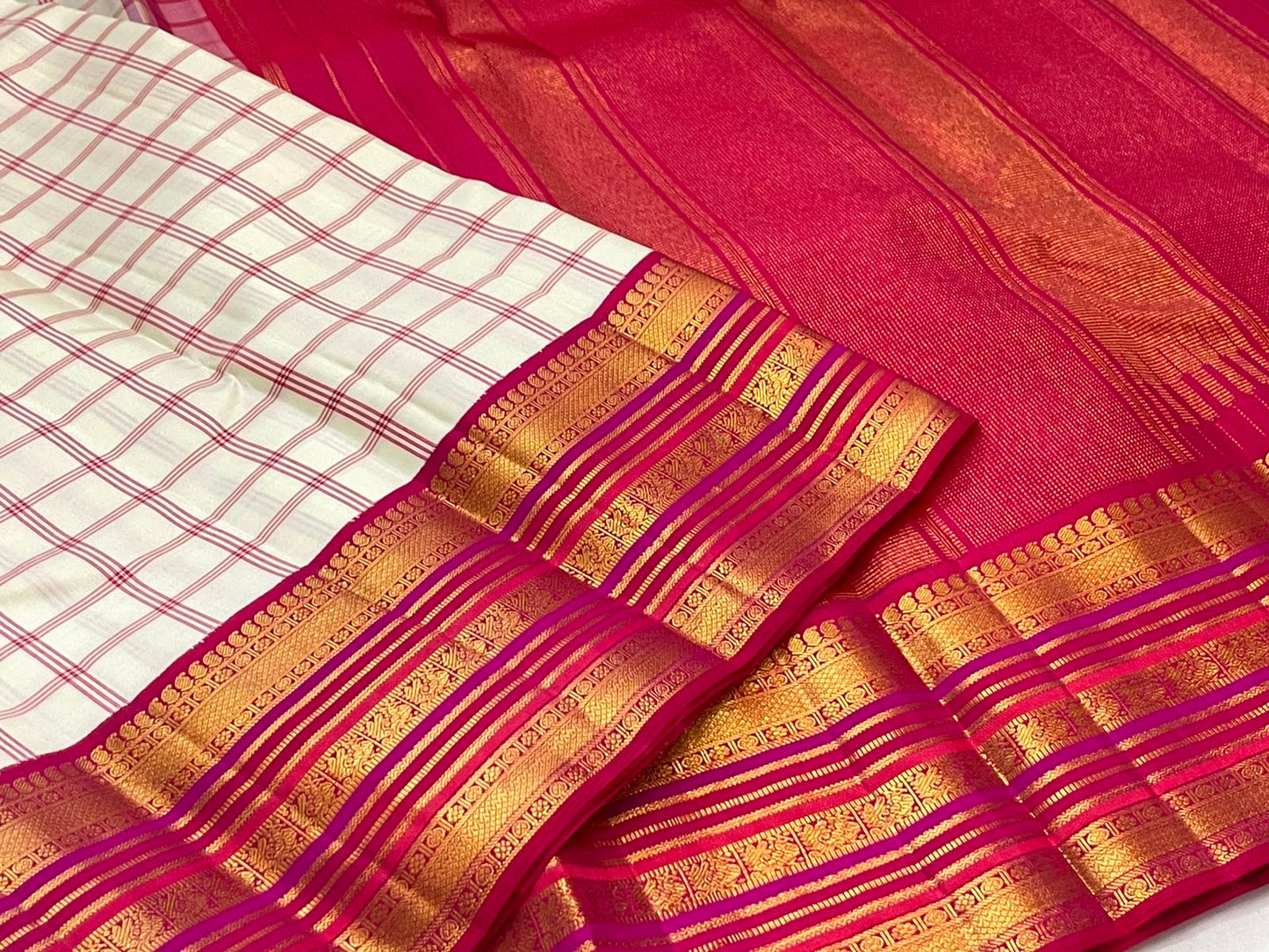 Ivory raspberry pink Kanchi Kattam saree with gold zari border, full view