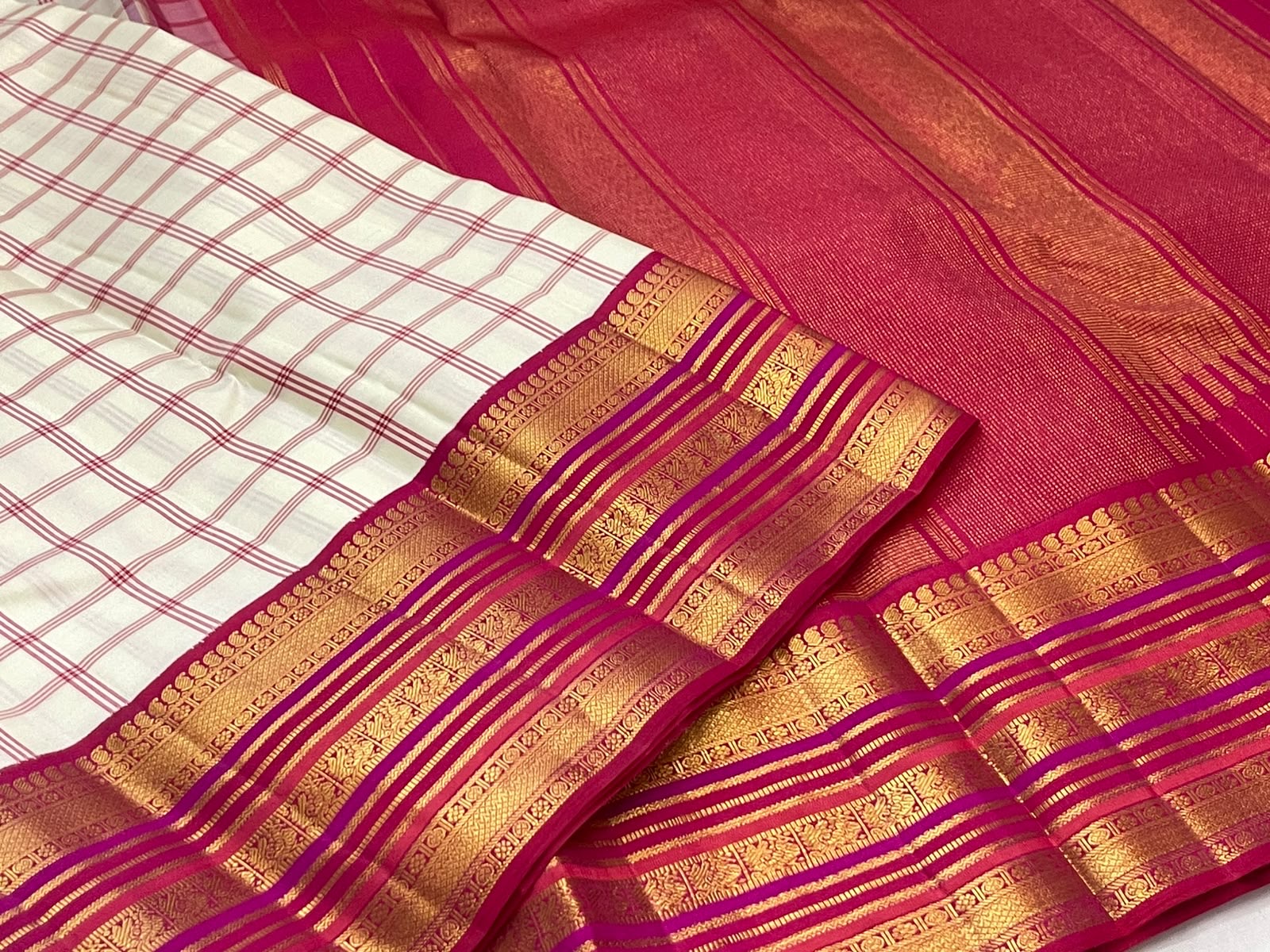 Ivory raspberry pink Kanchi Kattam saree with gold zari border, full view