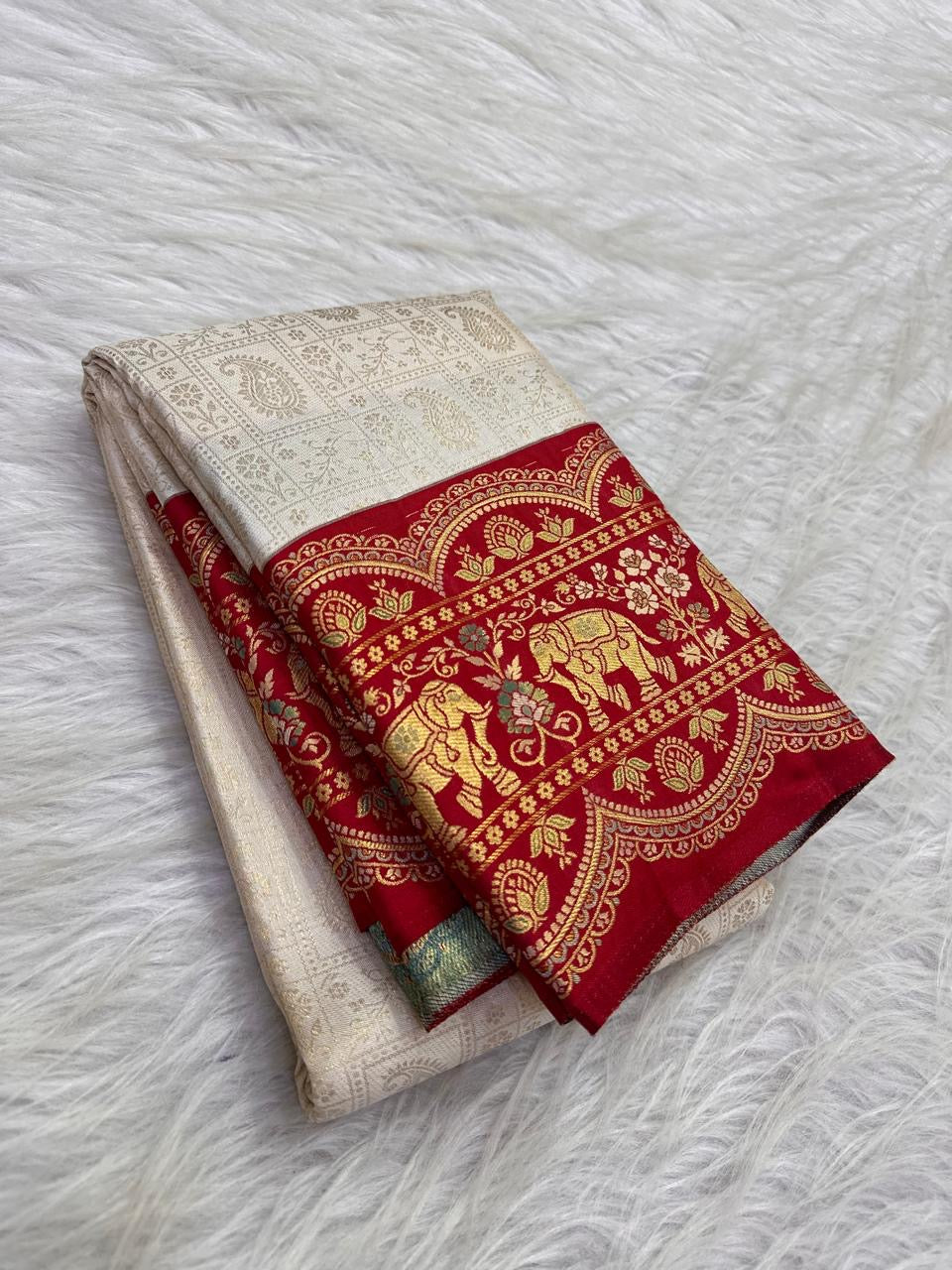 Crimson elephant and floral archway zari border on Kanchipuram silk