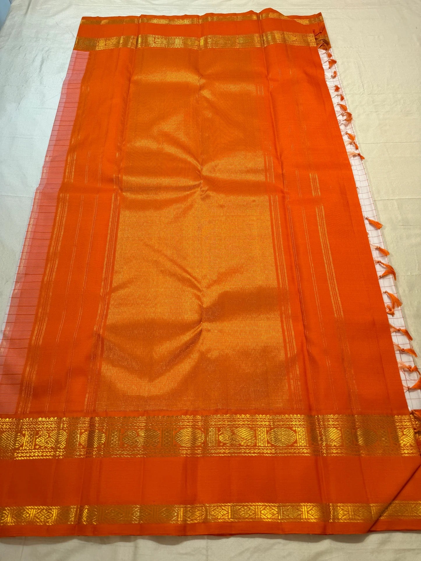 Ivory Kanchi Pattu saree overview with rust orange Rettapet border — Idam Living