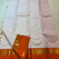 Ivory Kanchi Pattu saree Rettapet border detail in rust orange with gold zari temple motifs