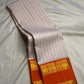 Ivory Kanchi Pattu saree folded full view — Idam Living
