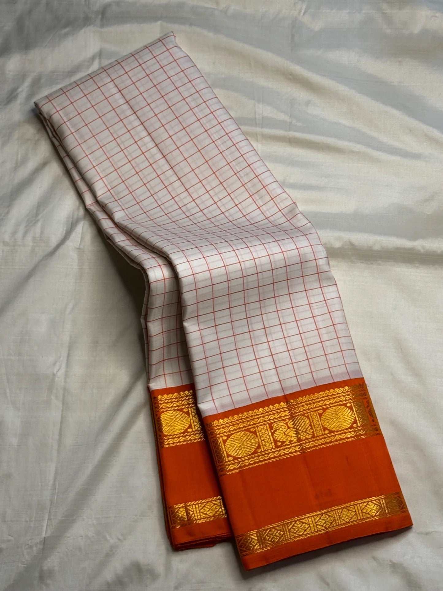 Ivory Kanchi Pattu saree folded full view — Idam Living
