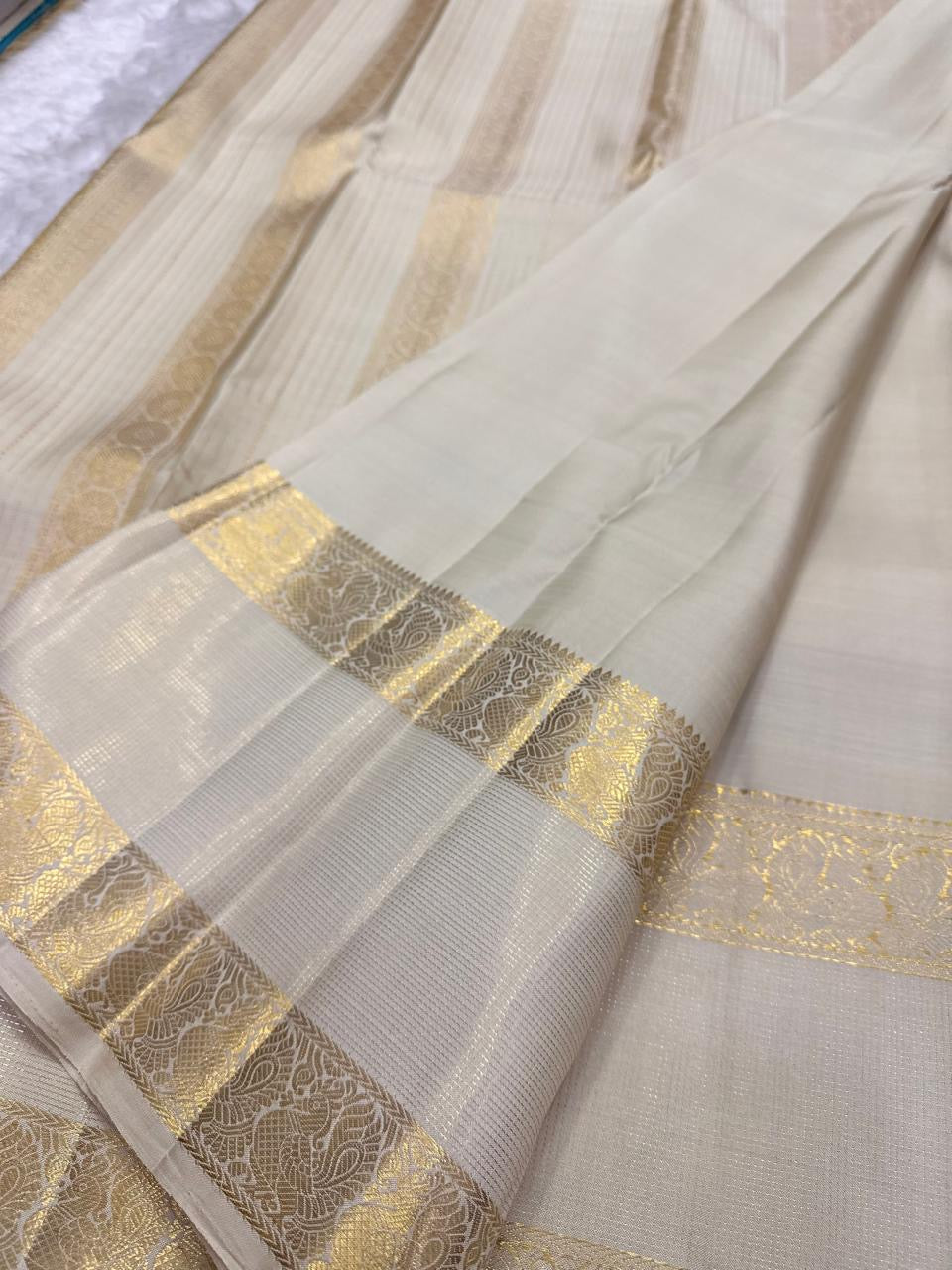 Warm Ivory Rettapet Kanchipuram saree with curling Kodi vine gold zari border