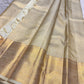 Gold zari border detail on ivory tissue Kancheepuram saree