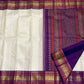 Warm Ivory Handwoven Pure Silk Kanchipuram Saree with Purple Border and Veldhari Detail, folded saree presentation