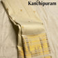 Ivory handwoven pure silk Kanchipuram saree full drape with zari buttas and raspberry pink selvedge border