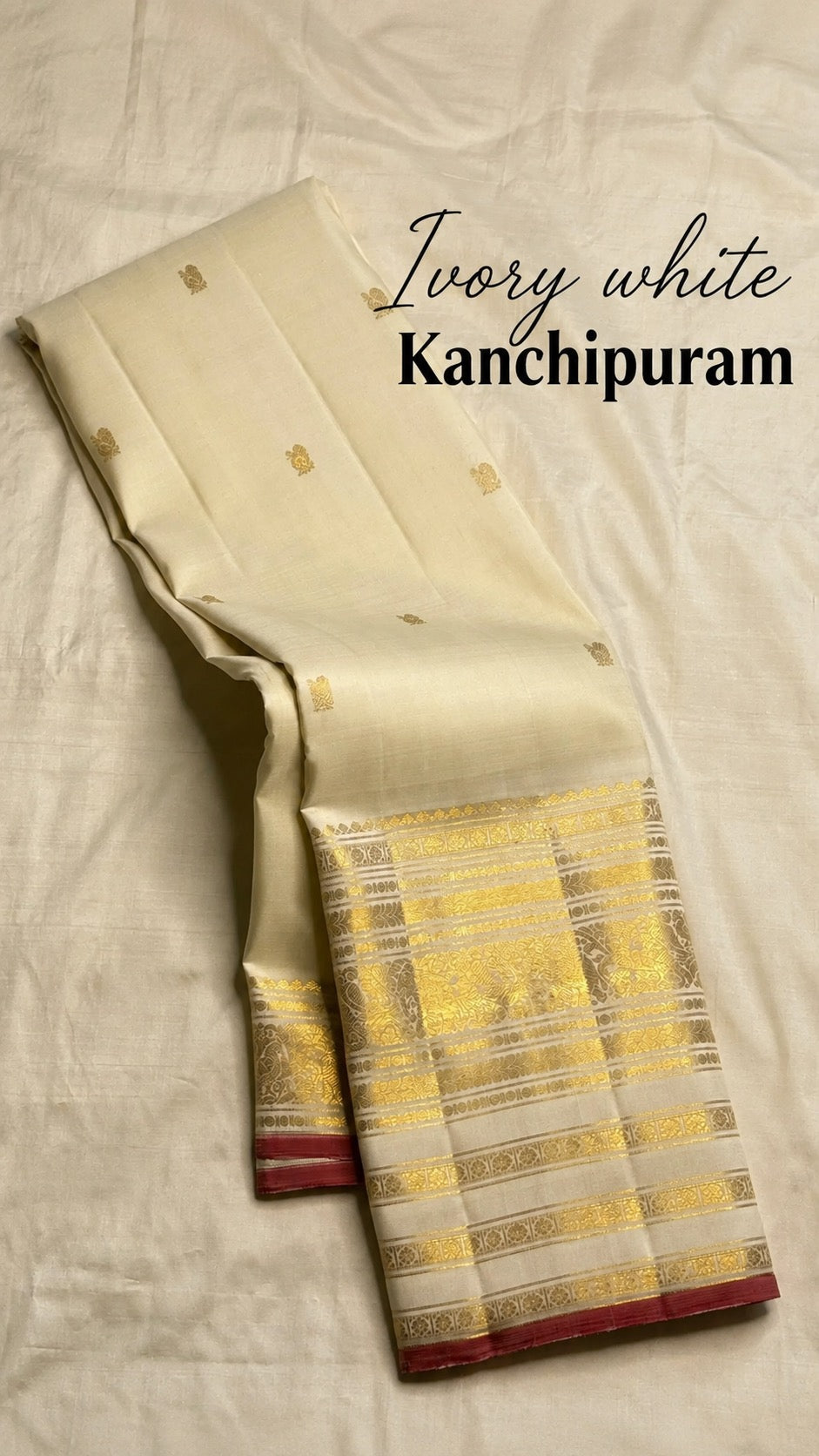 Ivory handwoven pure silk Kanchipuram saree full drape with zari buttas and raspberry pink selvedge border