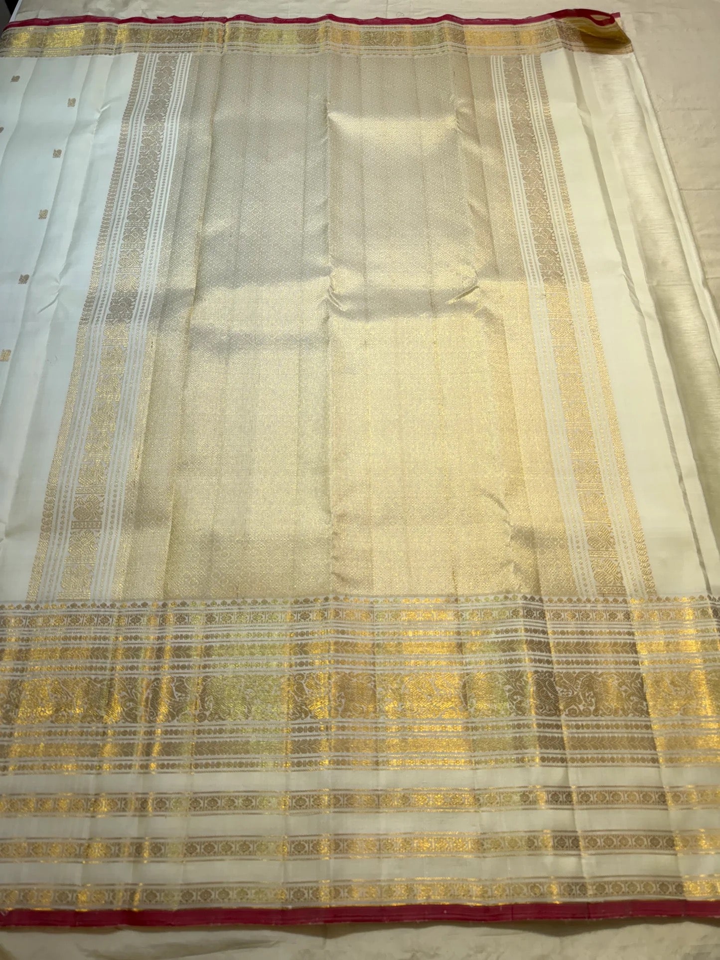 Gold zari border and pallu detail on ivory pure silk Kanchipuram saree