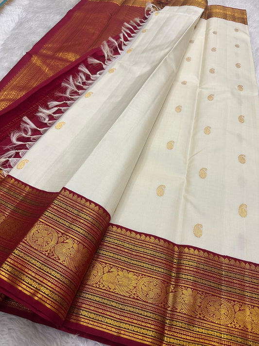 Maanga paisley butta in gold zari close-up on ivory white Kanjipuram pure silk saree — Idam Living
