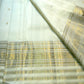 Close-up of raspberry pink selvedge edge on ivory pure silk Kanchipuram Butta saree
