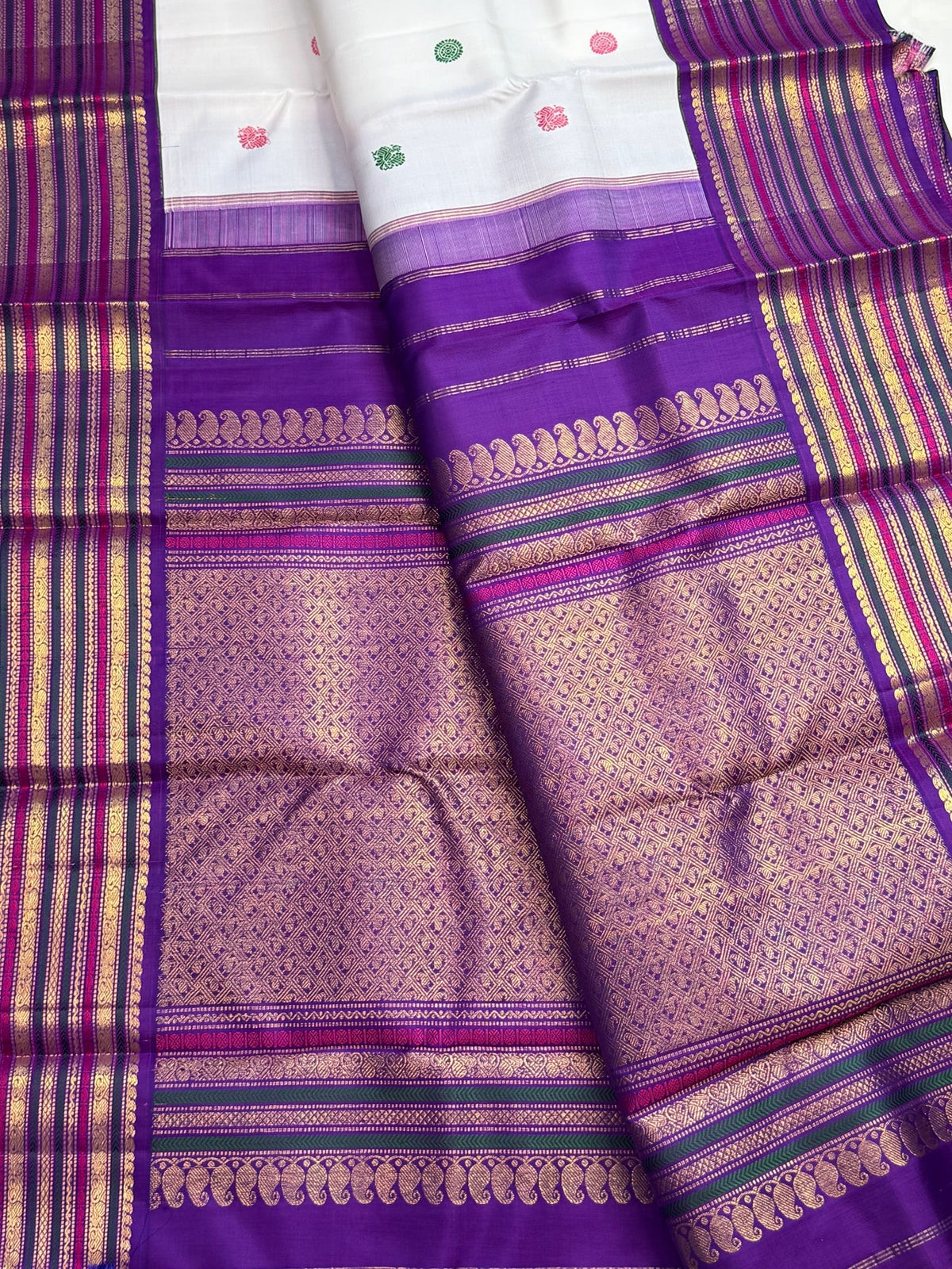 Layered Varisaipet border with traditional pettu work on a white vintage Pure Silk Kanchipuram saree.