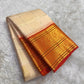 Korvai border with Paisley motifs in gold zari on deep red ground of ivory Kancheepuram saree