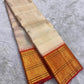 Ivory handwoven pure silk Kanjivaram saree with vermilion orange Zari Kattam border