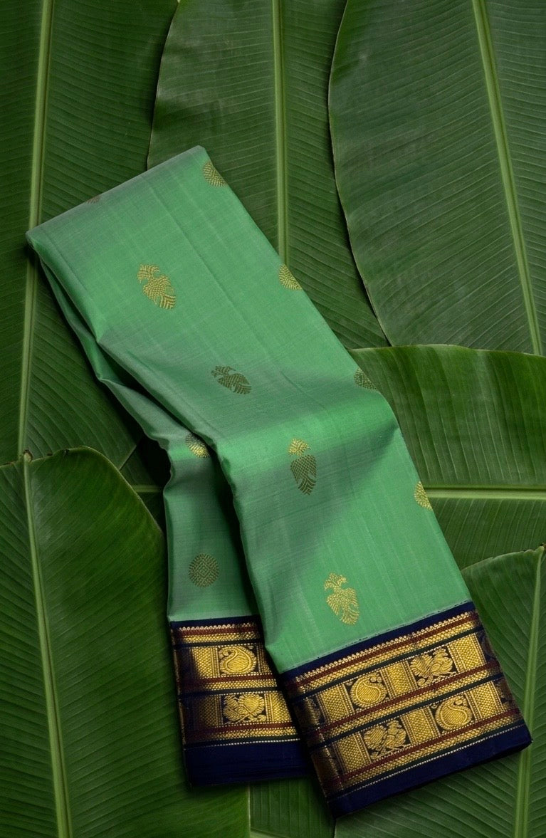Jade green and deep navy butta korvai Kanchipuram silk saree with mayil and maanga butta — Idam Living