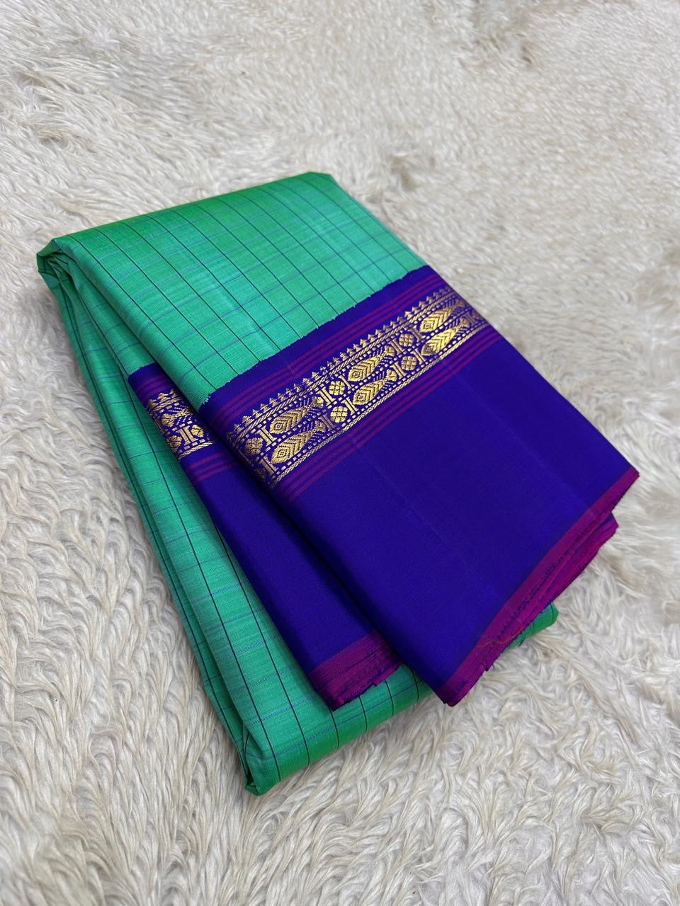 Jade Green and Royal Blue Handwoven Pure Silk Kanjipuram Saree with Kanchi Kattam Kaal Irangiya Border