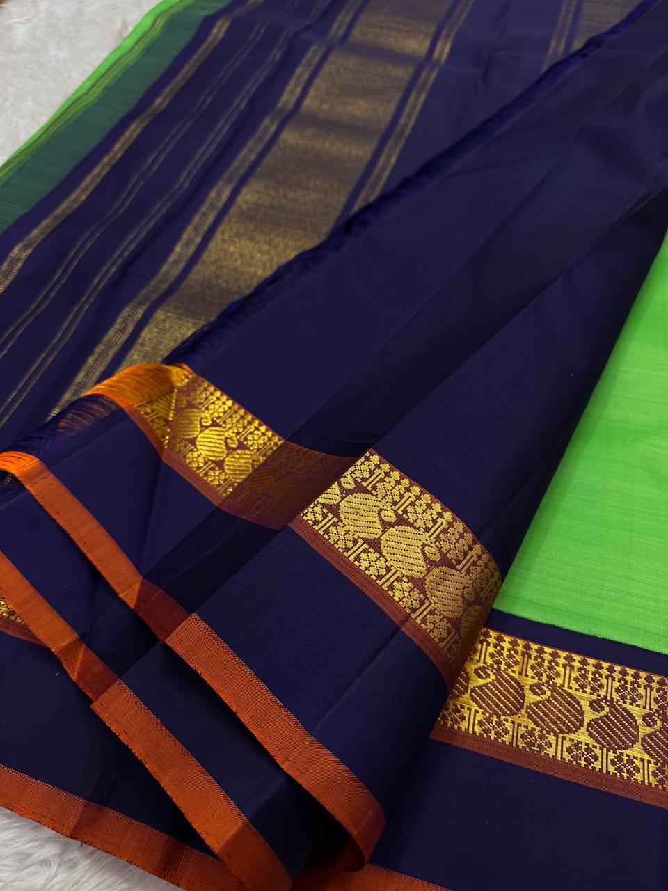 Kanchipattu silk saree in jade jewel green with navy blue border Korvai weave traditional zari detail