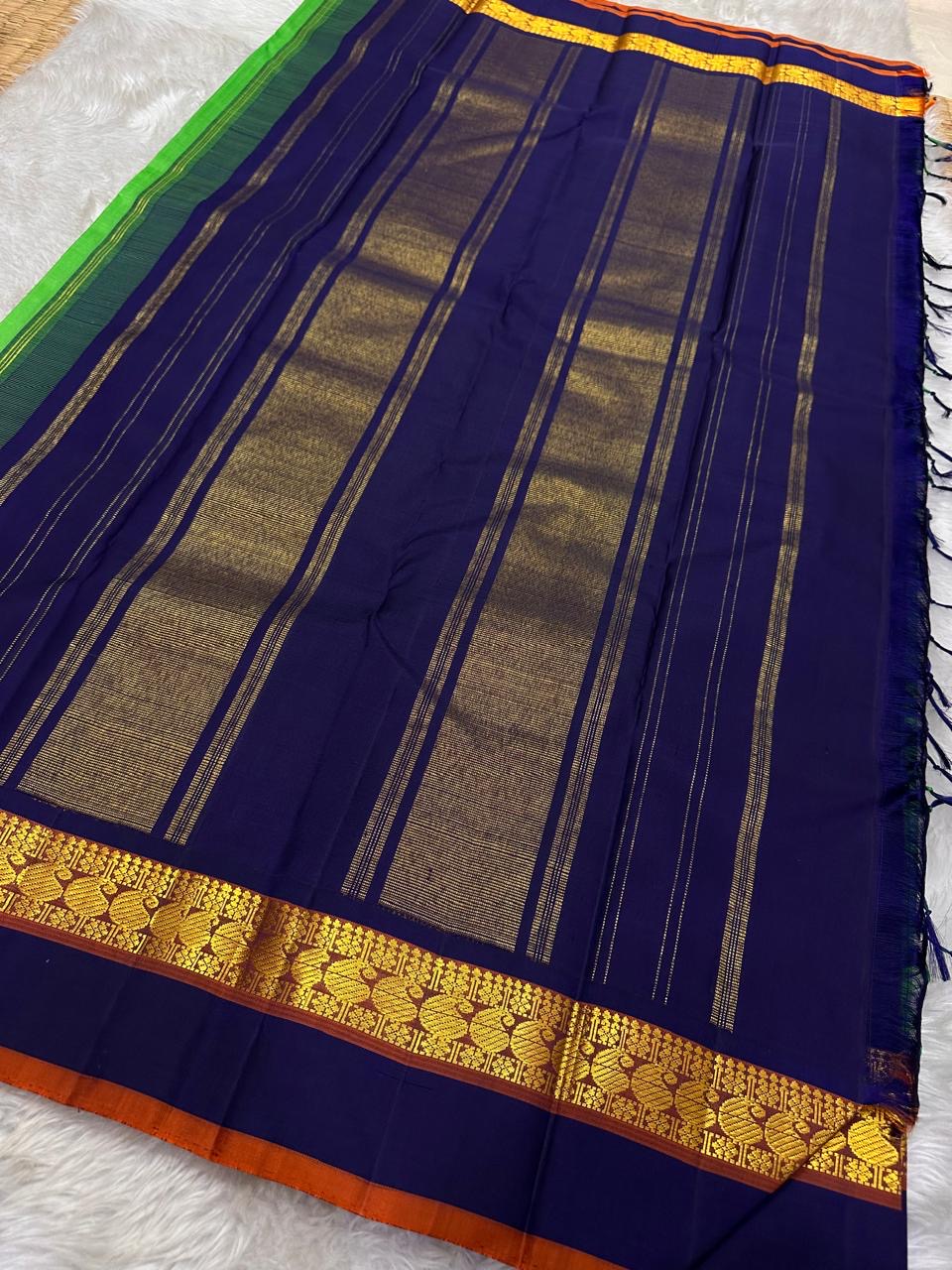 Kanchipattu silk saree in jade jewel green with navy blue border Korvai weave traditional zari detail