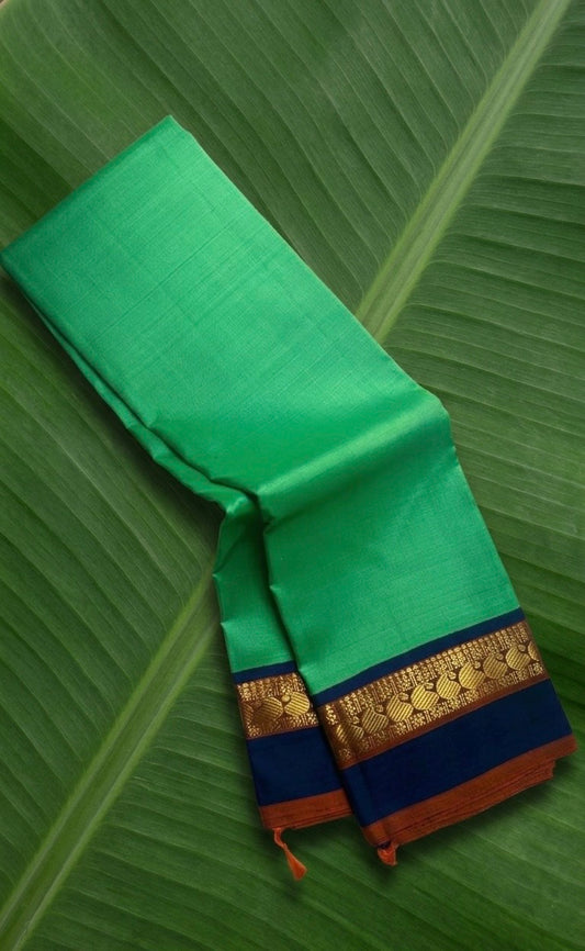 Kanchipuram silk saree in jade jewel green with navy blue border Korvai weave folded view