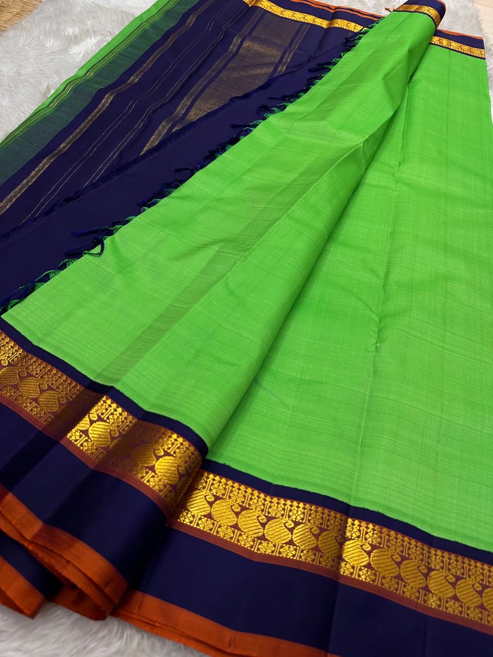 Kanchipattu silk saree in jade jewel green with navy blue border Korvai weave traditional zari detail
