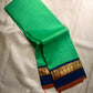 Kanchipattu silk saree in jade jewel green with navy blue border Korvai weave traditional zari detail