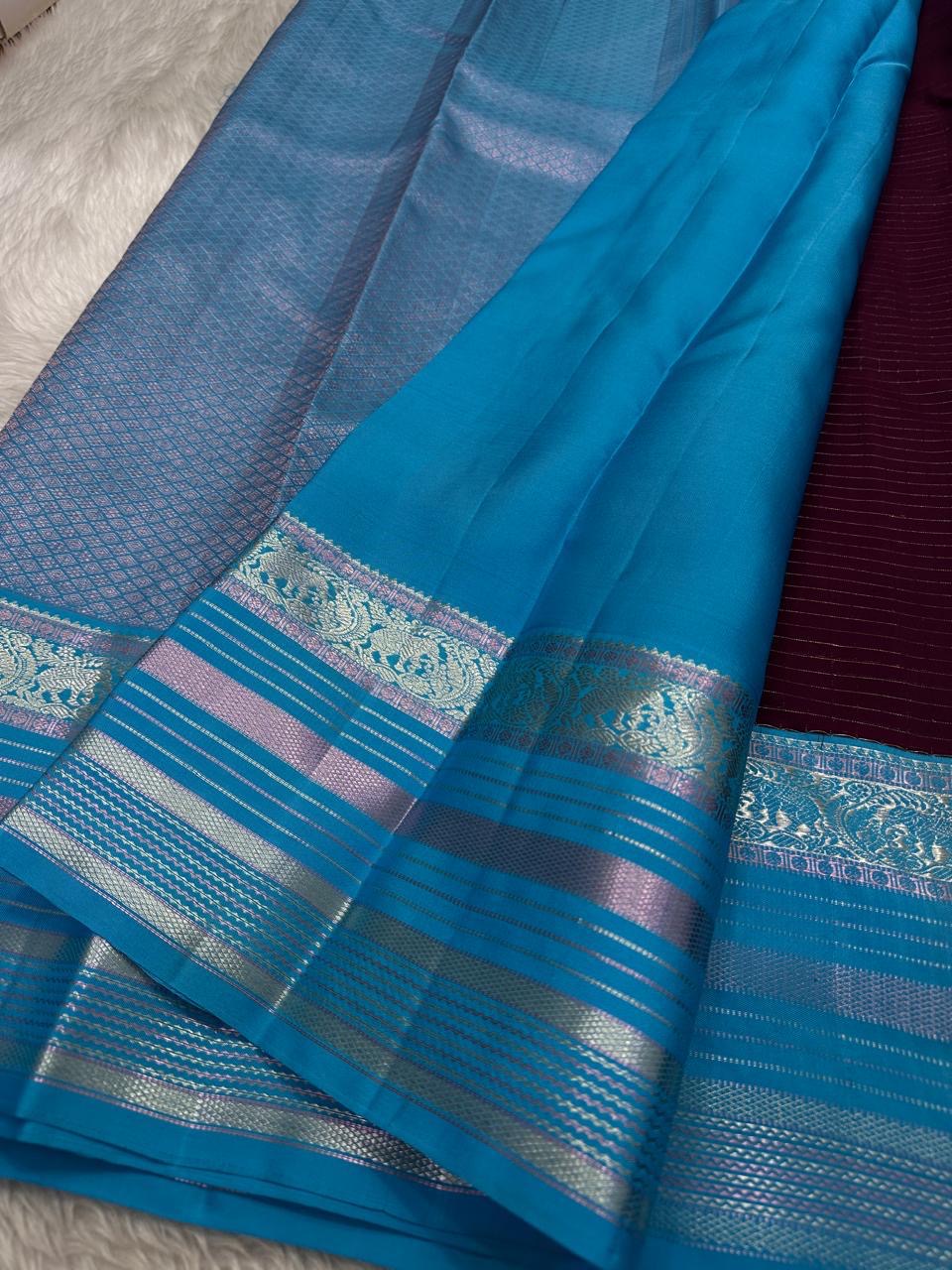 Kanchipattu silk saree in jamun purple with bright aqua border Zari Kattam weave traditional zari detail
