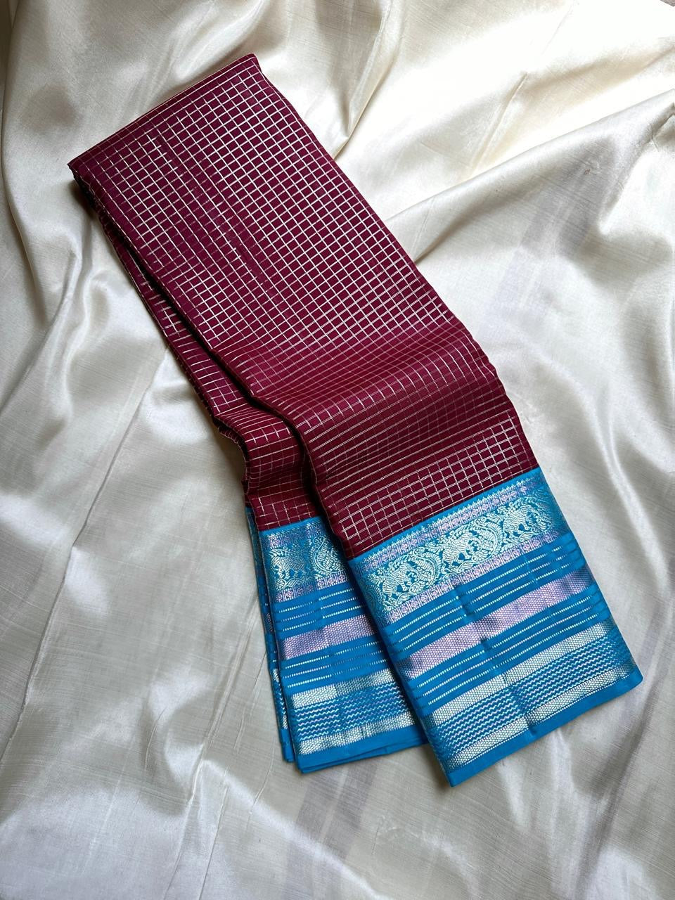 Kanchipattu silk saree in jamun purple with bright aqua border Zari Kattam weave traditional zari detail