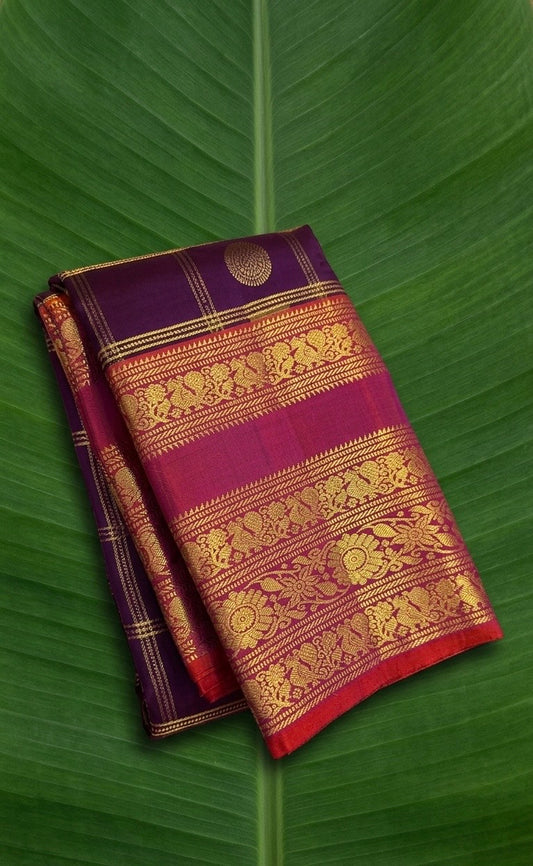 Kanchipuram silk saree in jamun purple with rich violet border Varisaipet Korvai weave folded view