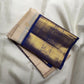Jasmine Ivory Kanchipuram saree contrasted with temple-indigo blue, gold zari panels and Reku detailing.