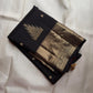 Black pure silk Kanjivaram Butta saree with broad antique-gold zari border.