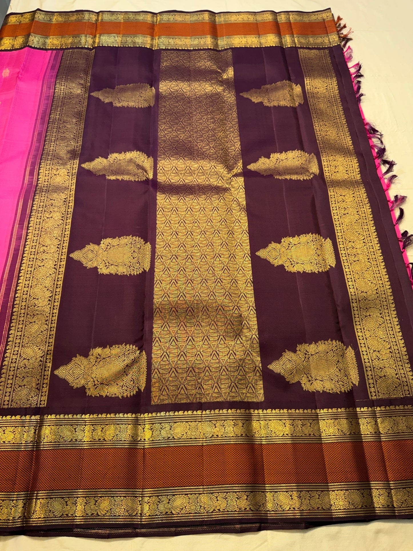 Pure Kanchipuram silk saree with orchid pink body brown border and classic zari mayil butta work