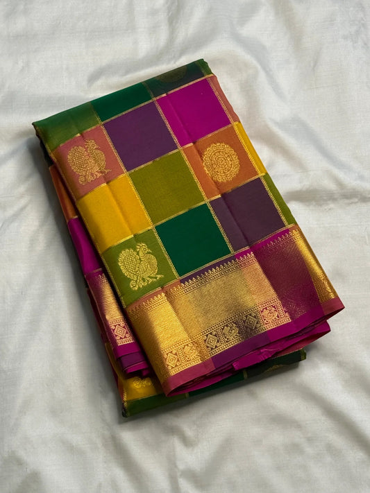 Jewel tone checked body on a Paalum Pazhamum Pure Silk Kanchipuram saree