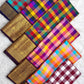 Folded multicolour orange blue silk with ornate purple gold border | Kanjipuram pure silk saree.