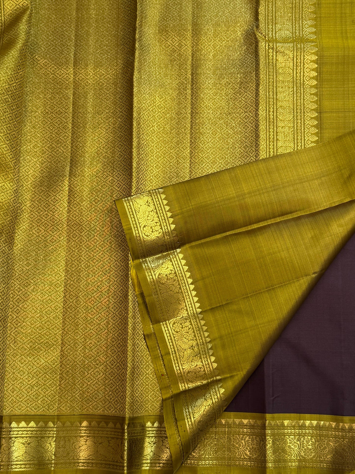 Handwoven Kanchipuram Butta saree in Kaapi Brown with Mehendi Green with distinctive traditional silk colouring