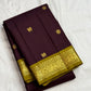 Kaapi Brown silk saree with repeated Mayil Chakram gold buttas and slim Mehendi Green and gold zari border