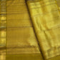 Kaapi Brown with Mehendi Green Kanchipuram silk saree with the body details of its Butta design
