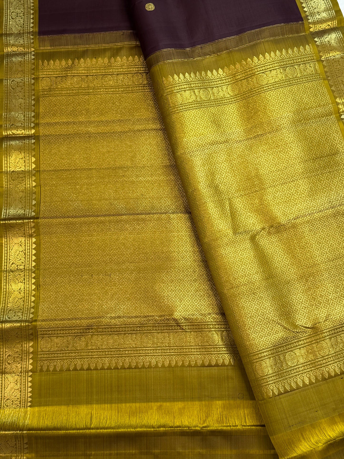 Kaapi Brown with Mehendi Green Kanchipuram silk saree with the body details of its Butta design