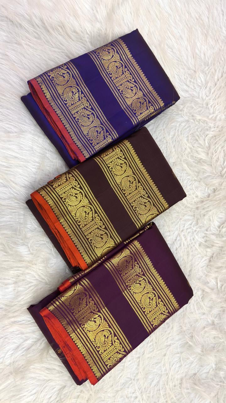 Architectural gold zari pallu with Annapakshi bird panels on the Kaapi Kottai Brown saree