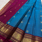 Deep Arakku-maroon Kanchipuram border with intricate classic-gold floral zari and ornamental bands.