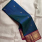 Handwoven Deep Kadal Neelam Blue Pure Silk Kanchipuram with a clean scattered Butta body.
